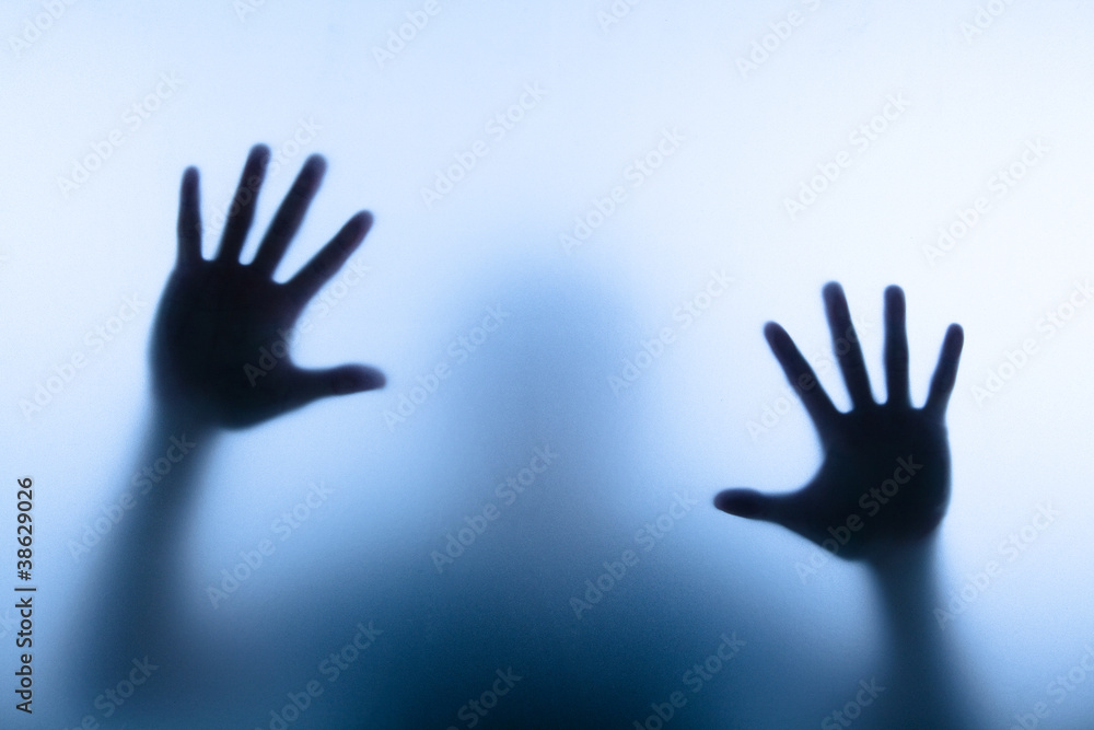 blur hand of man touching glass