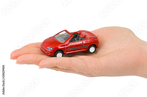 Hand and toy car