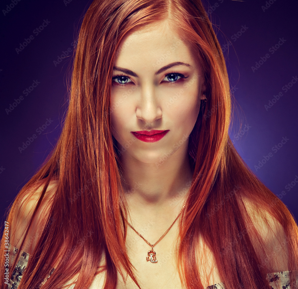 Fototapeta premium Portrait of attractive young female with fiery hair