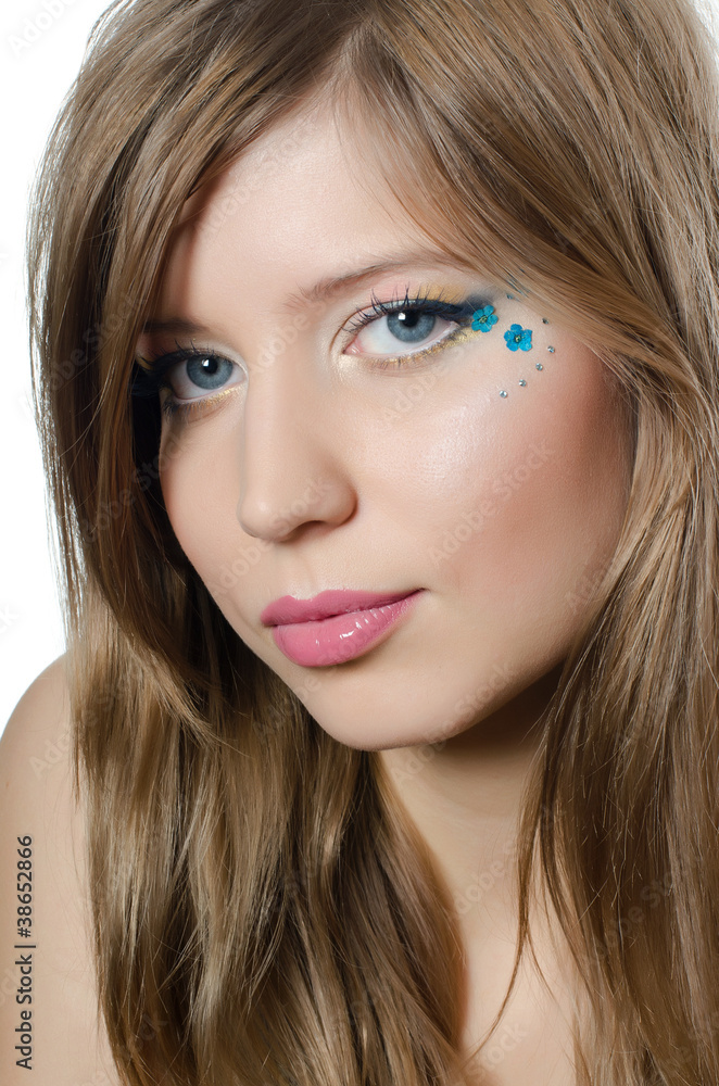 The young beautiful girl with a creative make-up The young beautiful girl with a creative make-up