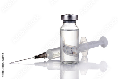 medical ampoules and syringe isolated on white photo