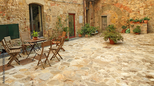 Leinwand Poster paved rustic terrace in Tuscany, Italy, Europe