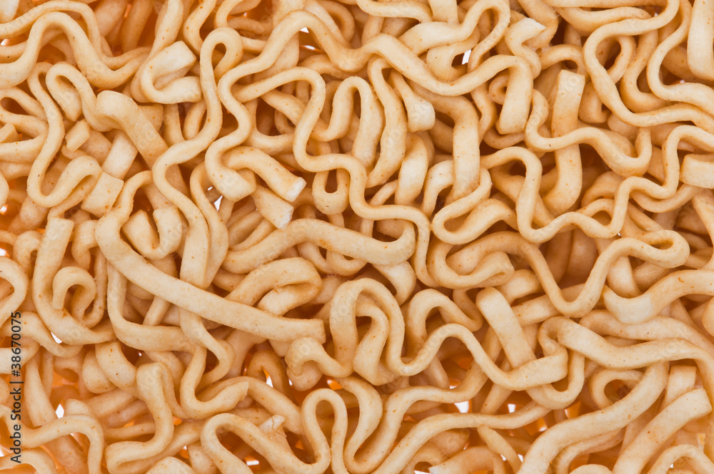 Texture of yellow instant noodles close up Texture of yellow instant noodles close up