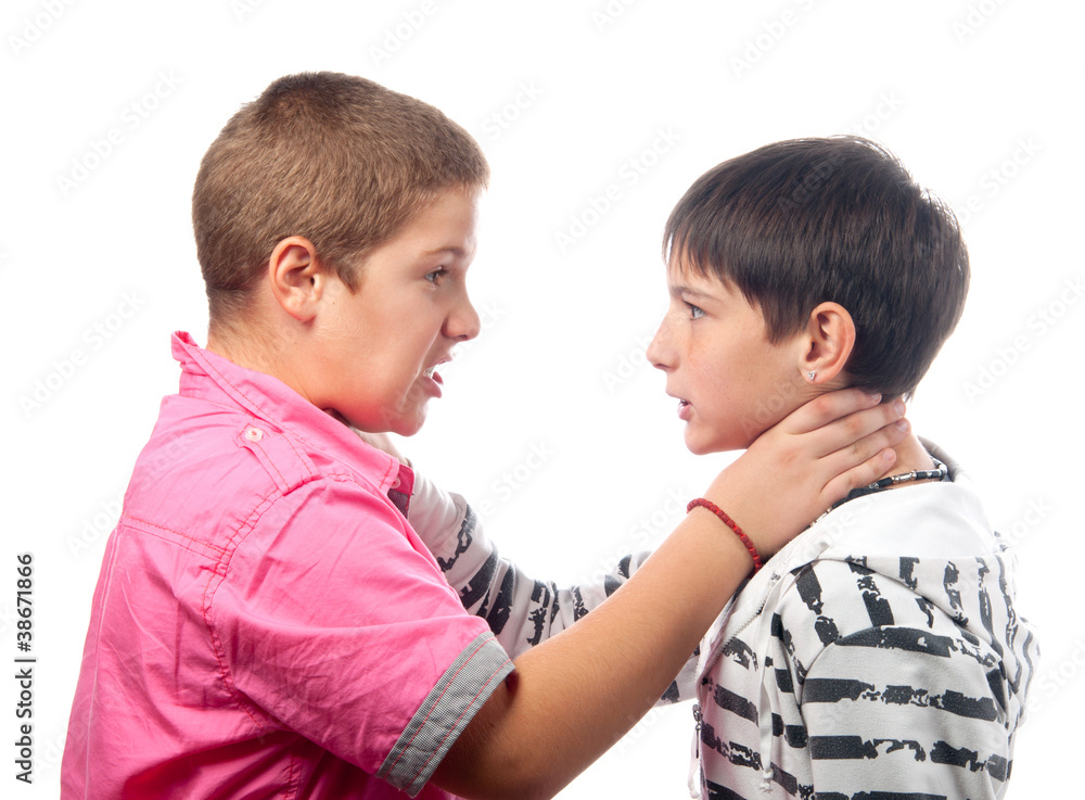 Two angry teenage boys holding each other necks during the fight Two angry teenage boys holding each other necks during the fight