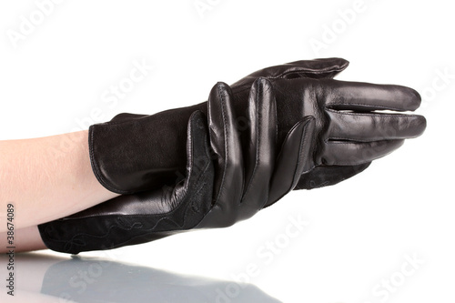 women's hands in black leather gloves isolated on white