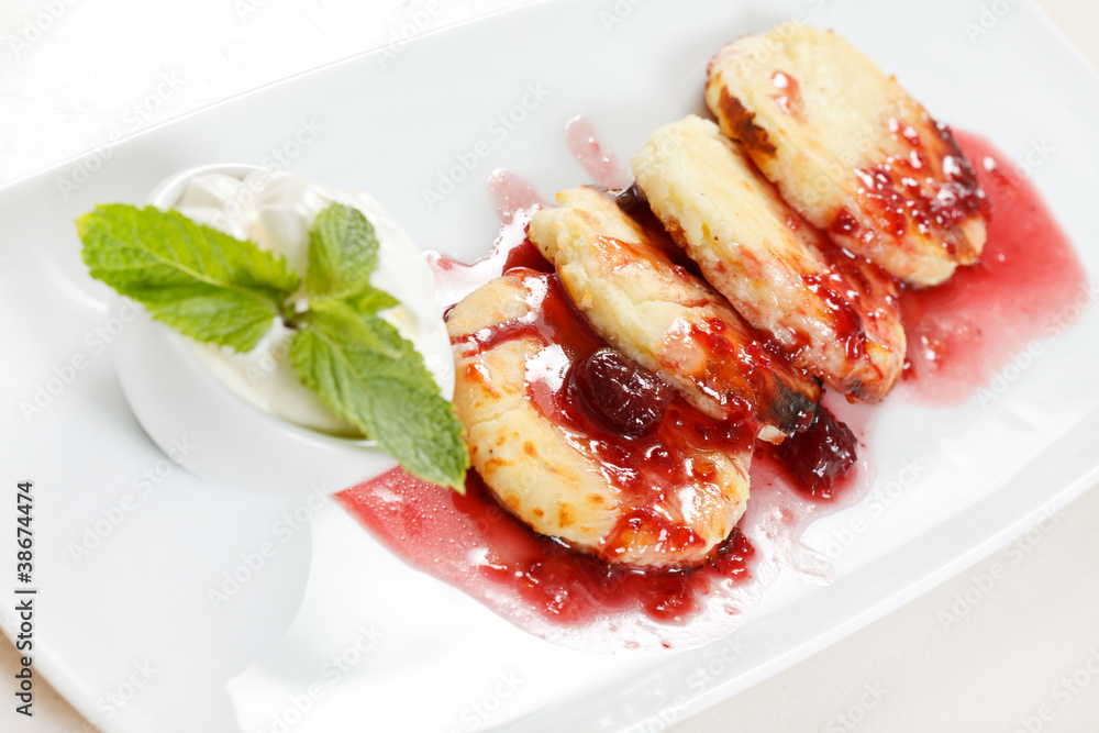 Cheese pancakes with cherry sauce Cheese pancakes with cherry sauce