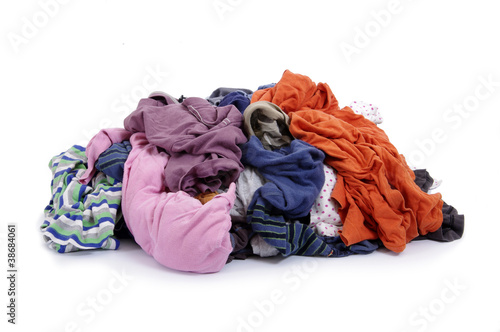 Big heap of colorful clothes on white background