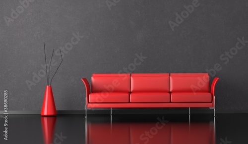 Wohndesign - rotes Sofa vor grauer Wand