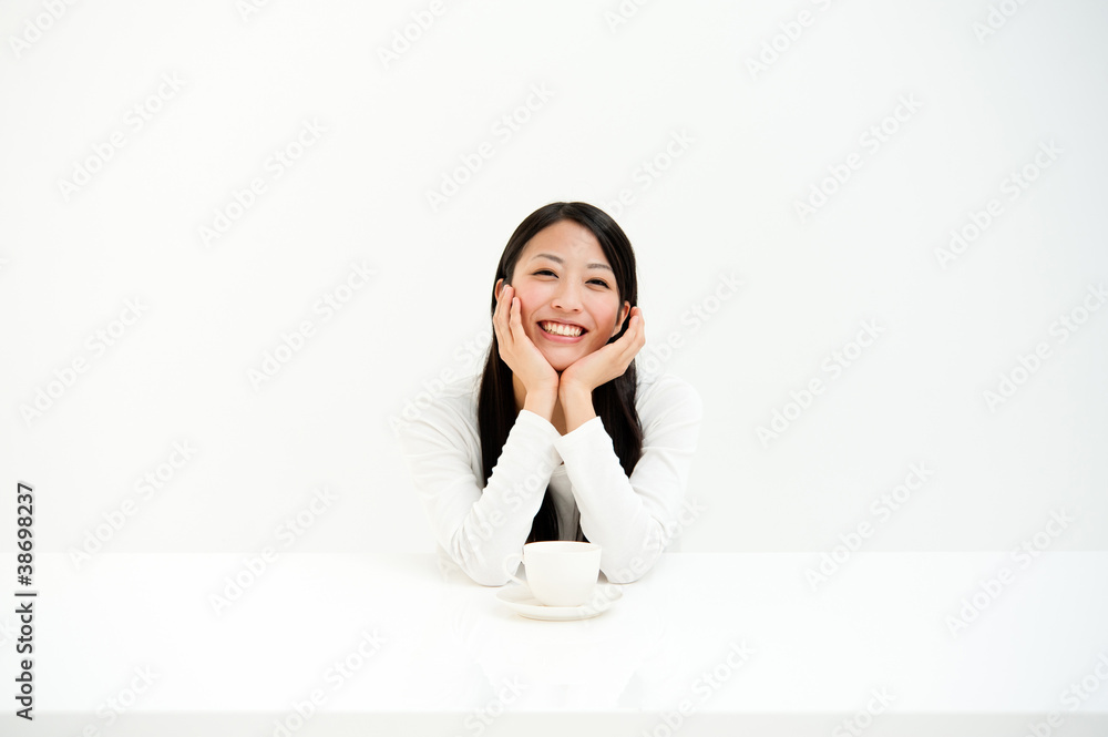 attractive asian woman drinking in the white room attractive asian woman drinking in the white room