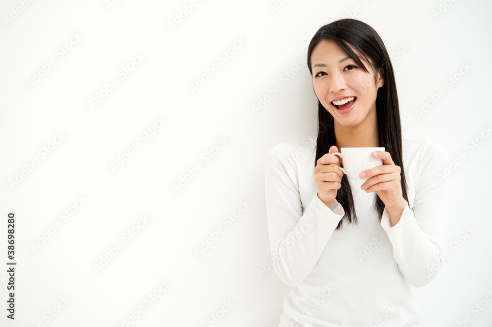 attractive asian woman relaxing in the white room attractive asian woman relaxing in the white room