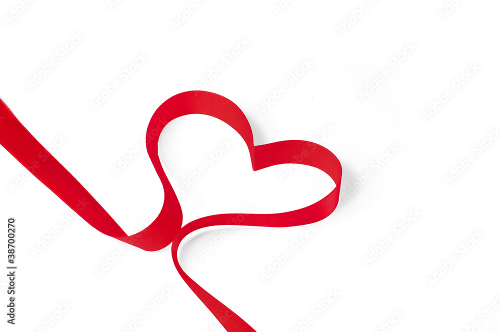 Red ribbon shaped as a heart isolated on white