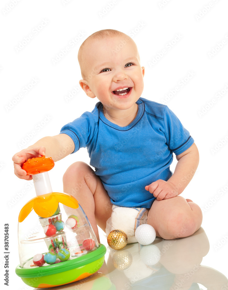 Laughin toddler boy with favorite toy Laughin toddler boy with favorite toy