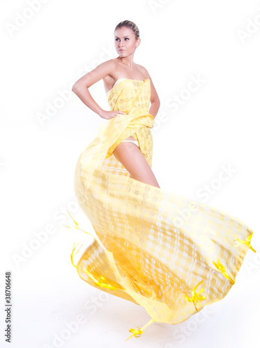 Beautiful dancer wearing yellow dress isolated on white