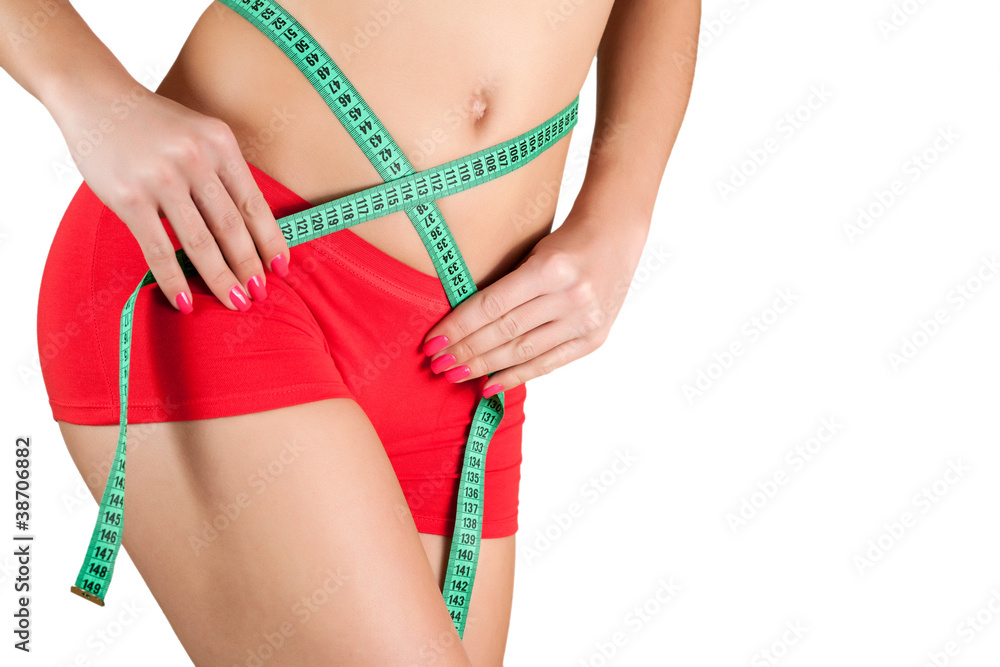 Woman measuring perfect shape of beautiful hips.