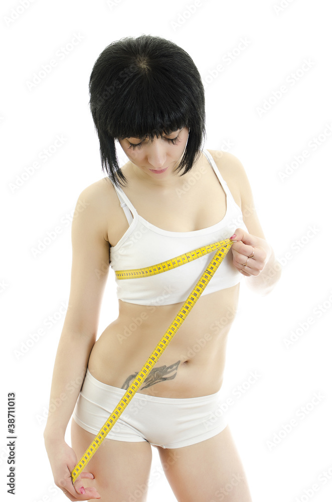 Woman measuring her breasts. Isolated on white Woman measuring her breasts. Isolated on white