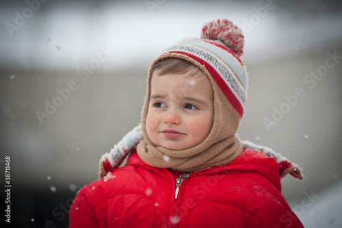 Portrait of baby boy in the snow.