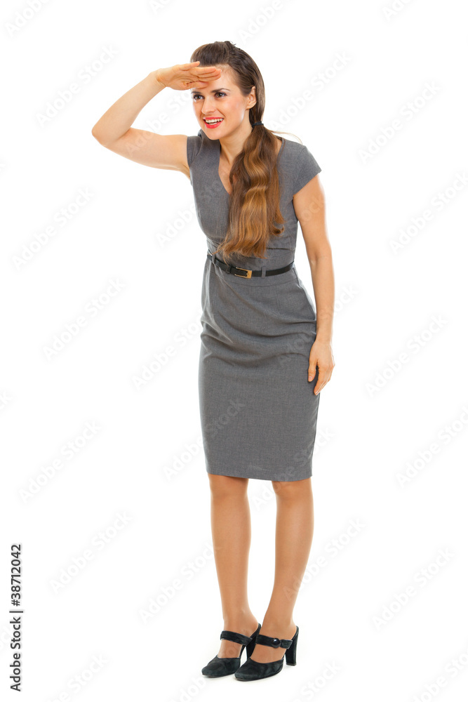 Full length portrait of business woman looking into distance Full length portrait of business woman looking into distance