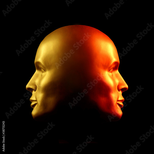 Two-faced head statue, red and gold photo