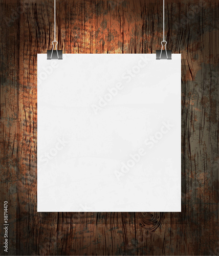 Blank on the paper clips. On dark grunge background.