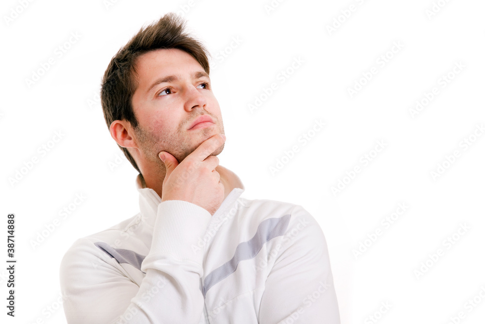 Thinking young man looking up on white background Thinking young man looking up on white background