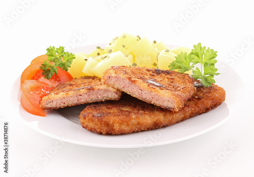 plate of breaded meat and vegetables