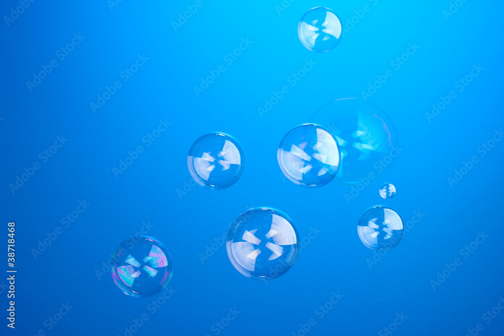 Soap bubble on blue background Soap bubble on blue background