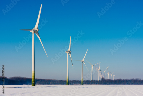 Rural winter landscape in the Netherlands with big windturbines