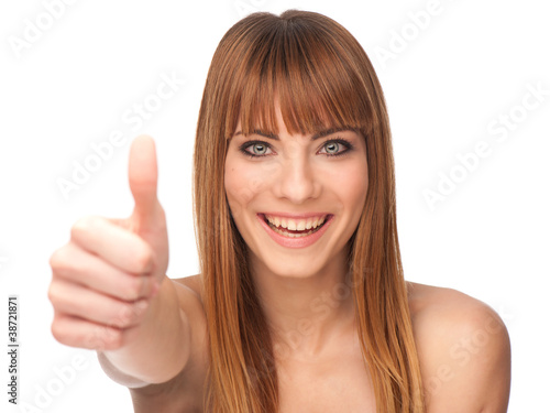 Attractive young girl with thumb up