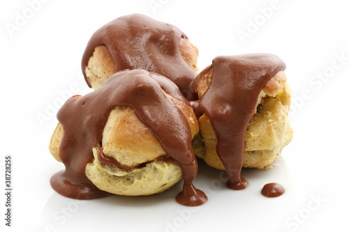 Принти на полотні three profiteroles over white background