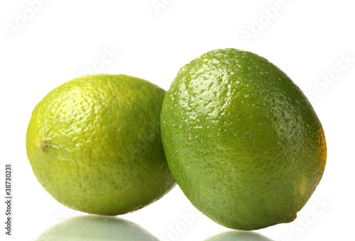two ripe limes isolated on white