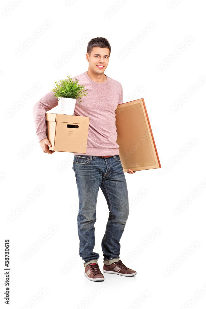 Smiling male moving into a new home Smiling male moving into a new home