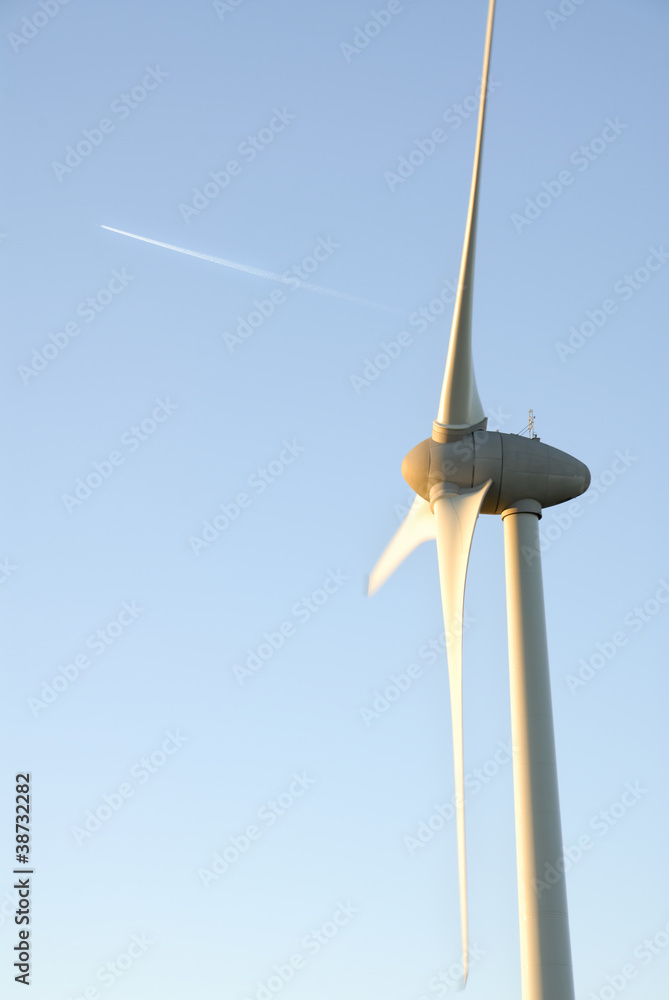 One Wind Turbine and Plane Vapour Trail. One Wind Turbine and Plane Vapour Trail.