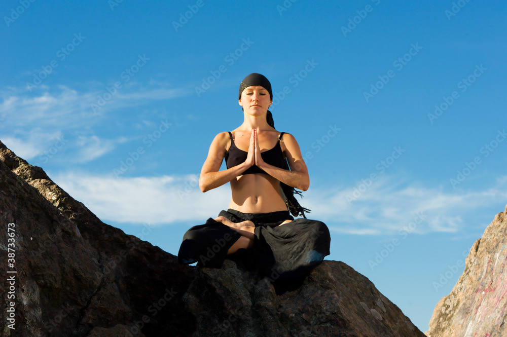 beautiful woman sitting in lotus pose on the beach beautiful woman sitting in lotus pose on the beach
