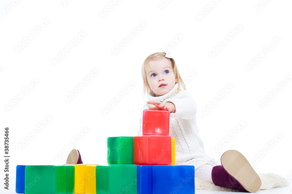 Baby girl plays with toy blocks Baby girl plays with toy blocks