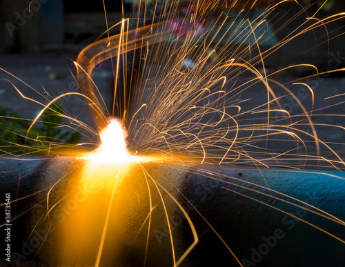 Sparks of the fused metal