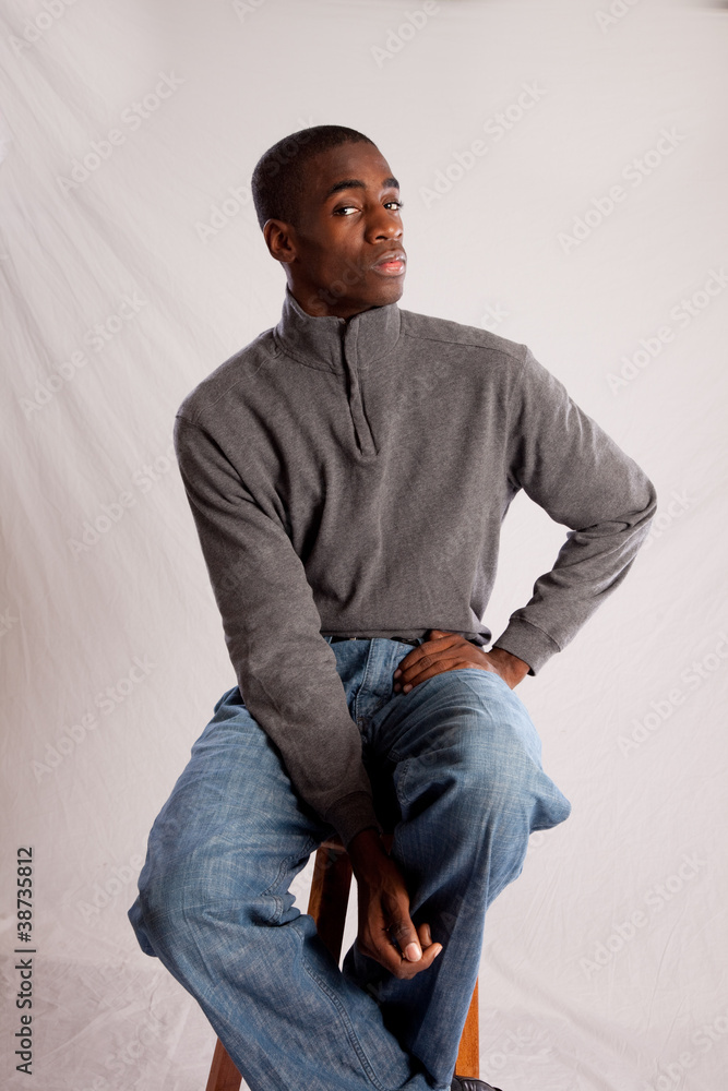 Handsome black man in sweater in thoughtful mood Handsome black man in sweater in thoughtful mood