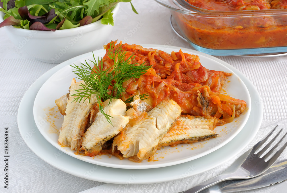 Baked fish in tomato sauce with vegetables Baked fish in tomato sauce with vegetables
