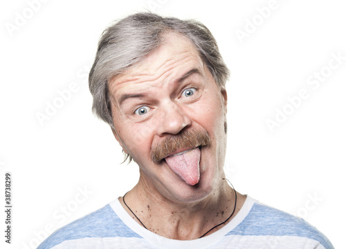 funny mature man shows tongue isolated on white background © Tiler84