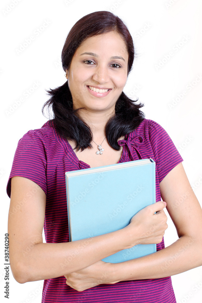 Smiling successful young student holding text books Smiling successful young student holding text books