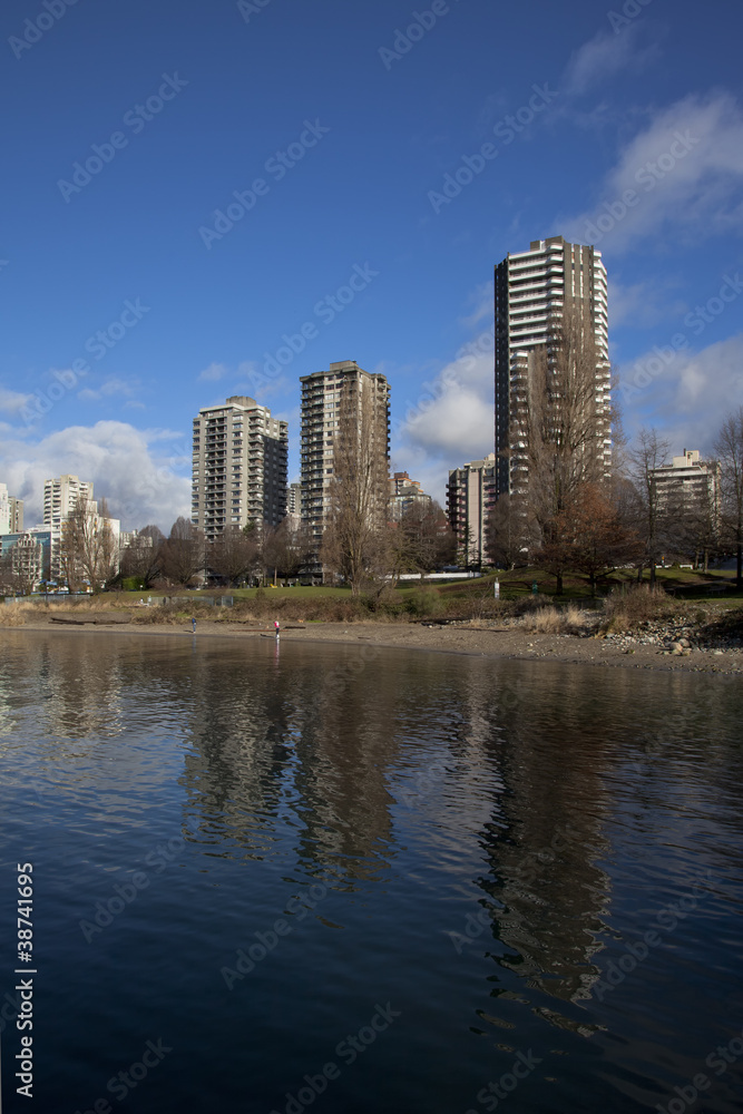 downtown highrises reflect off of english bay waters, vancouver downtown highrises reflect off of english bay waters, vancouver
