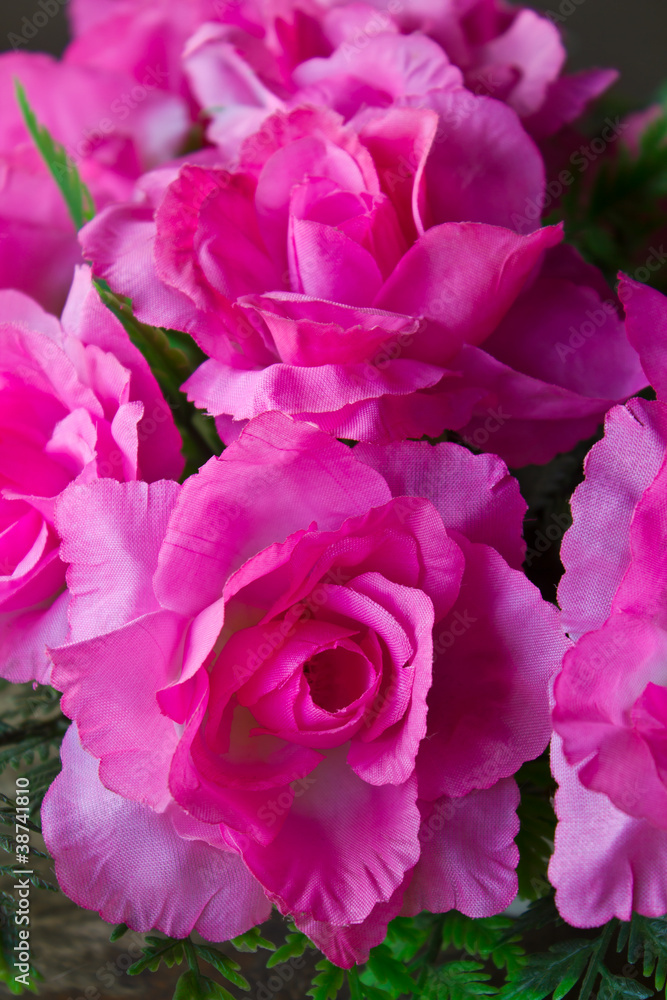 Pink artificial roses made ??of synthetic fiber. Pink artificial roses made ??of synthetic fiber.