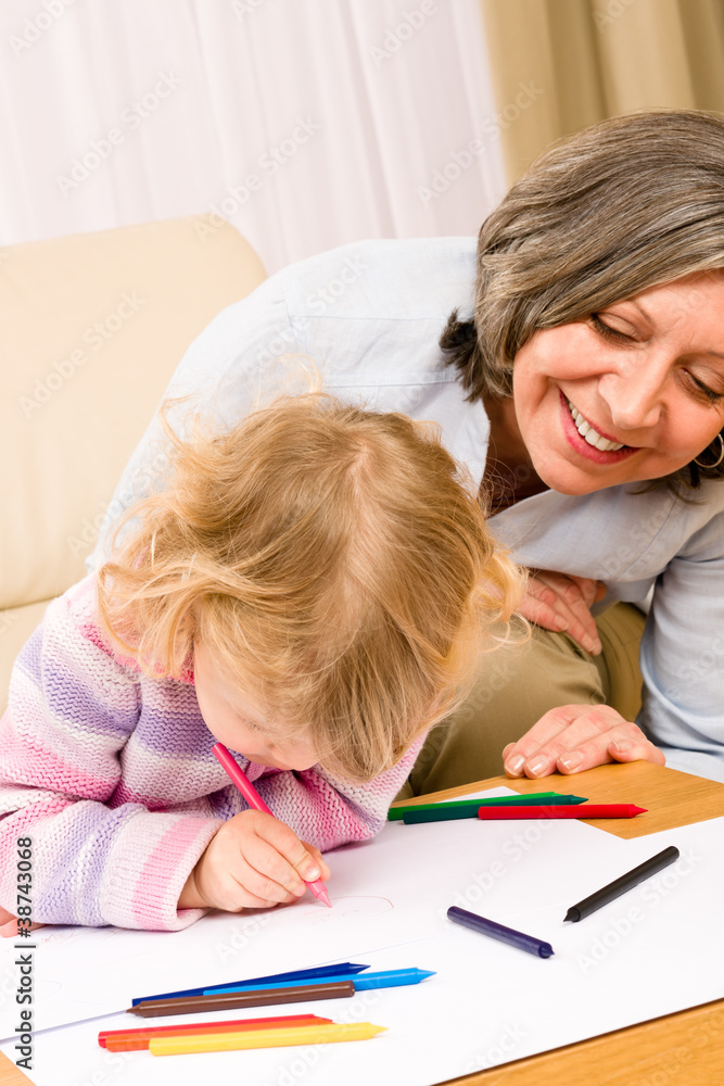 Grandmother and granddaughter drawing at home Grandmother and granddaughter drawing at home