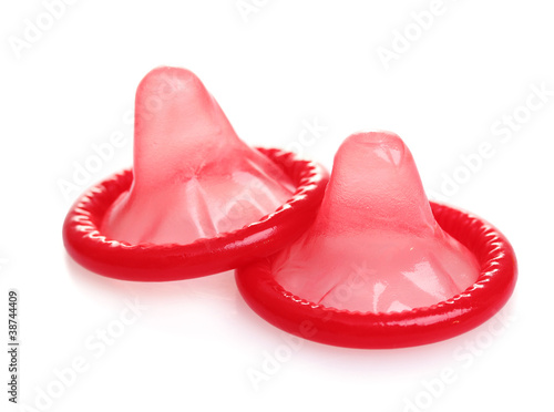 Red condoms isolated on white