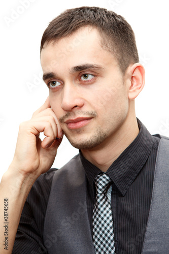 Portrait of businessman talking on cellphone isolated over white