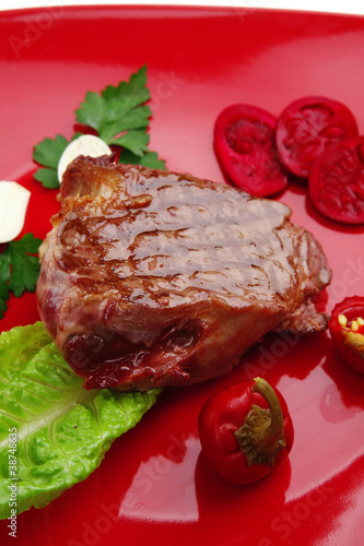 meat food : roast beef garnished on red plate