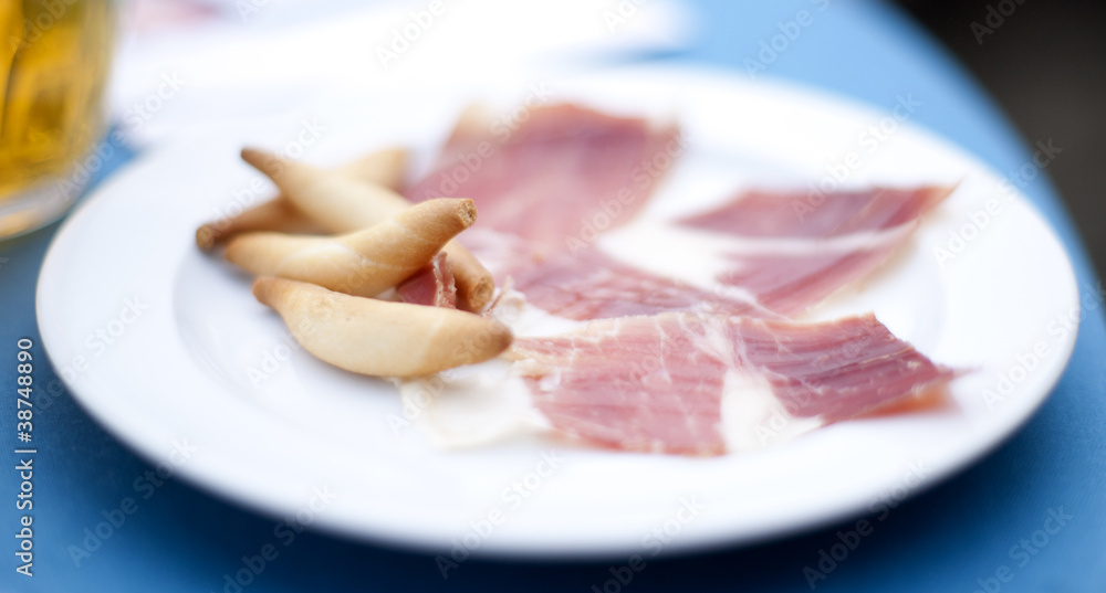 Jamon iberico (prosciutto) ham with extra virgin oil baked picos