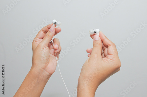 Hand holding earphone.Music and sond photo