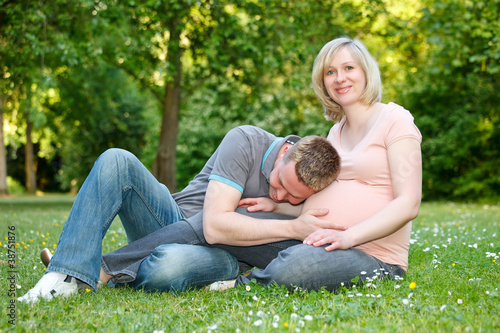 Pregnant couple in the park