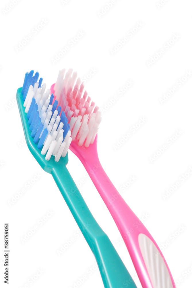 Close Up of 2 Toothbrushes Against white Background
