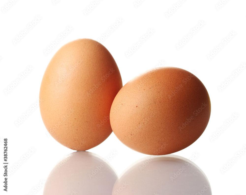 two brown eggs isolated on white two brown eggs isolated on white